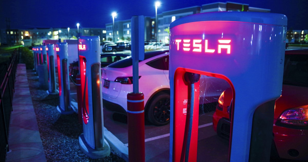 Electric vehicles charging at a station overnight