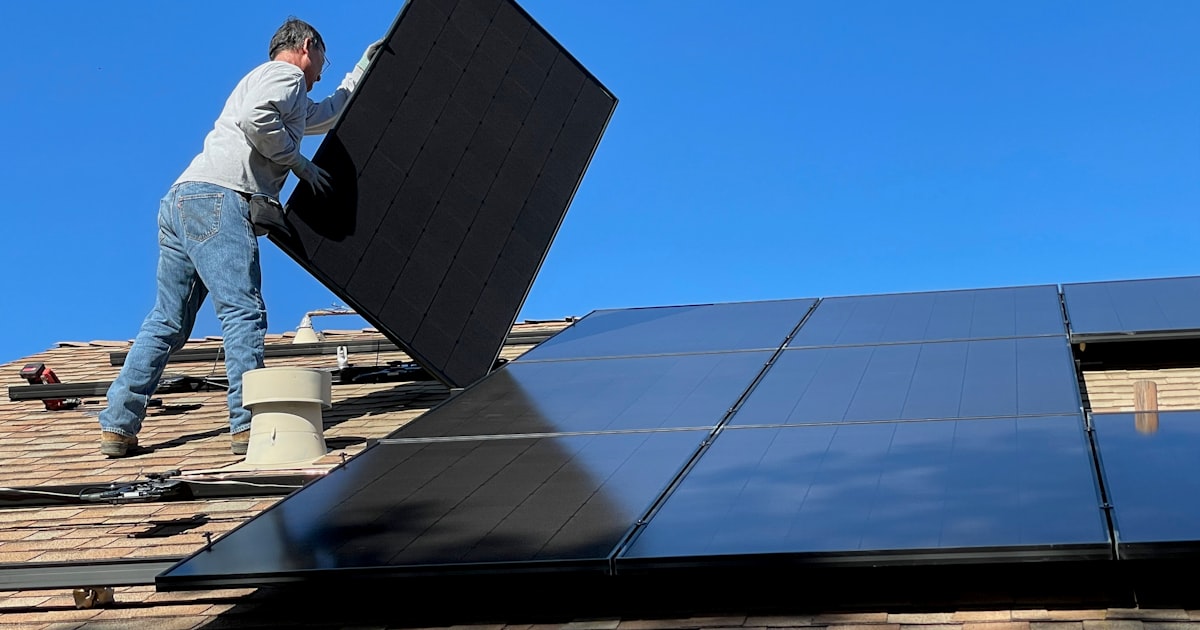 Solar panel system being installed on a residential roof